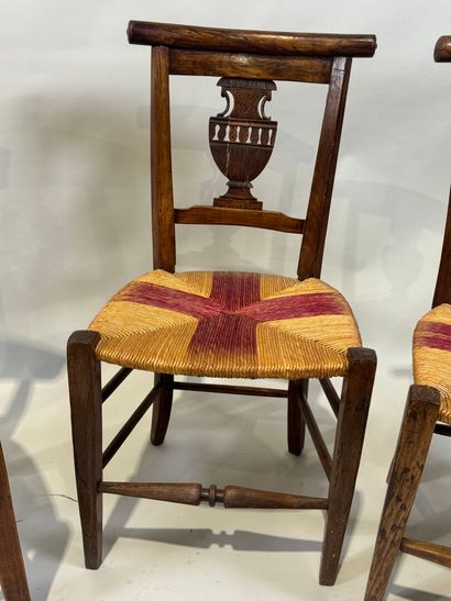 Two pairs of walnut chairs, straw-bottomed...