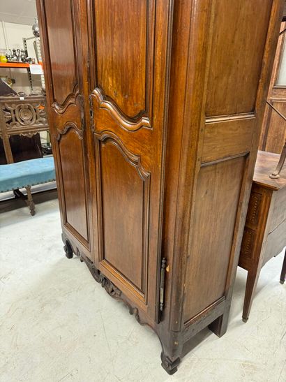 Rustic walnut cabinet opening with two doors.
19th...