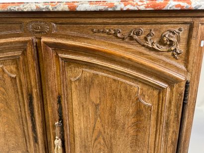 Light oak sideboard opening with two molded...