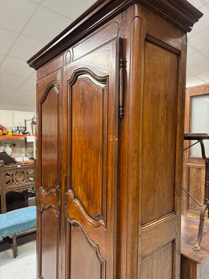 Rustic walnut cabinet opening with two doors.
19th...