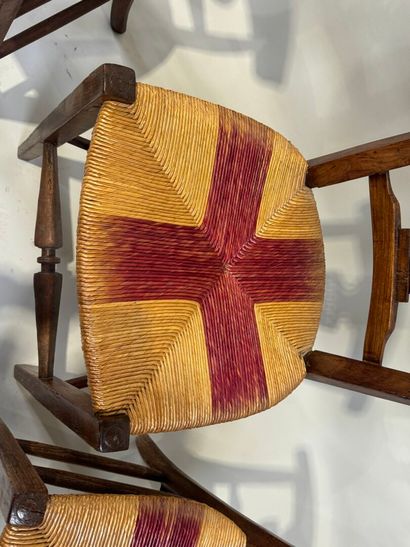 Two pairs of walnut chairs, straw-bottomed...