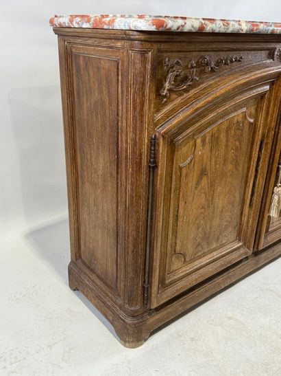 Light oak sideboard opening with two molded...