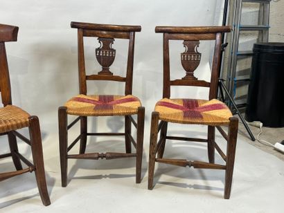 Two pairs of walnut chairs, straw-bottomed...