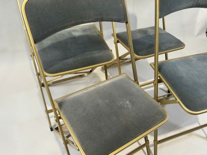 Set of four folding chairs in gilded metal,...