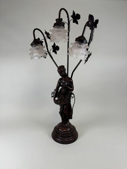 Three-armed resin lamp depicting a woman...