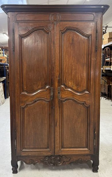 Rustic walnut cabinet opening with two doors.
19th...