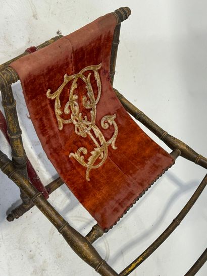 Gilded wood and velvet folding armchair decorated...