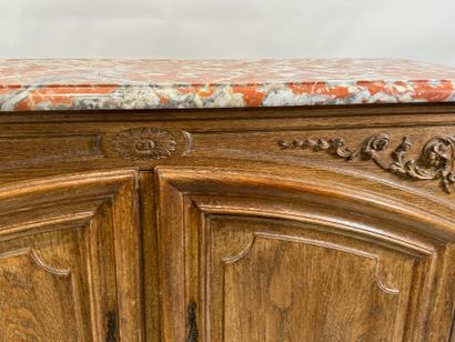 Light oak sideboard opening with two molded...