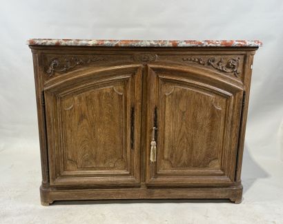 Light oak sideboard opening with two molded...