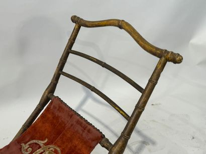 Gilded wood and velvet folding armchair decorated...