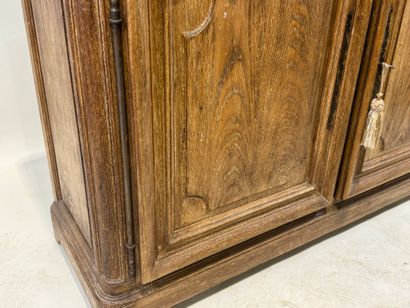 Light oak sideboard opening with two molded...