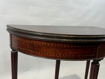 Mahogany and brass veneered half-moon console...