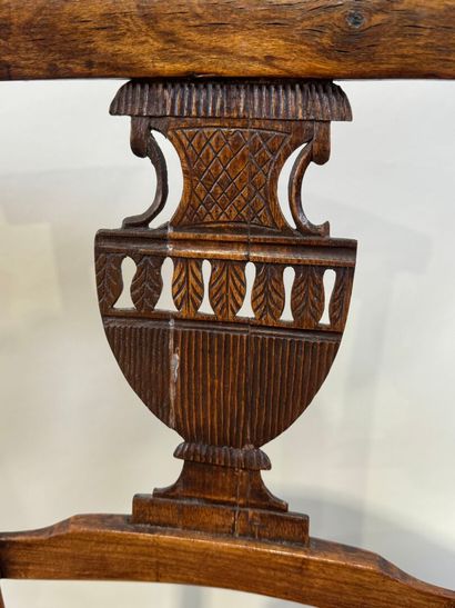 Two pairs of walnut chairs, straw-bottomed...