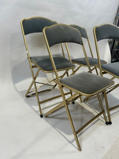 Set of four folding chairs in gilded metal,...