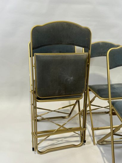 Set of four folding chairs in gilded metal,...