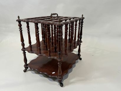 Mahogany magazine rack with openwork bars...