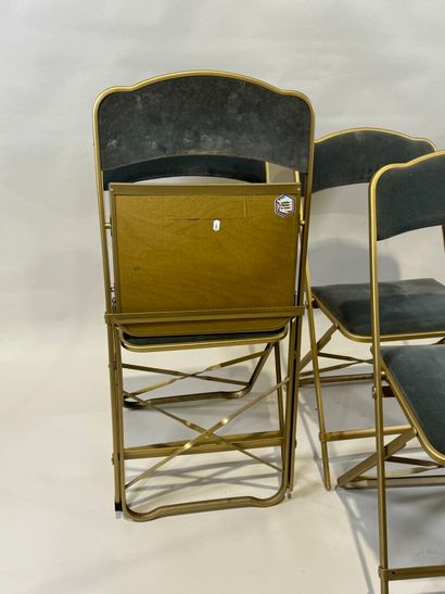 Set of four folding chairs in gilded metal,...