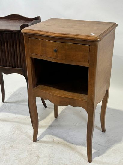 Two wooden bedside tables, one with curtain...