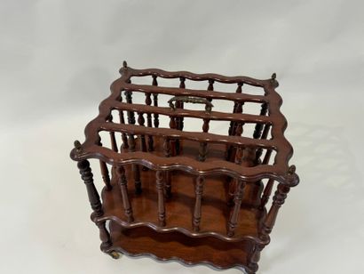 Mahogany magazine rack with openwork bars...