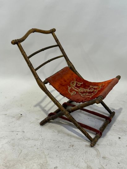Gilded wood and velvet folding armchair decorated...