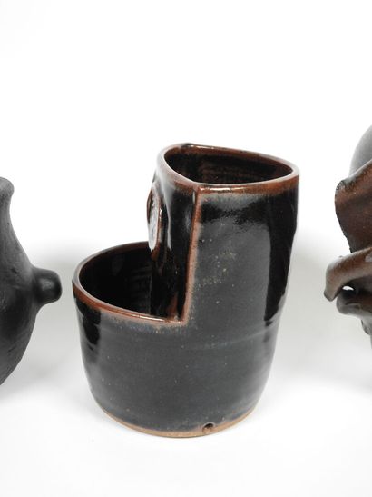 Set including :
- Black-glazed ceramic pitcher,...