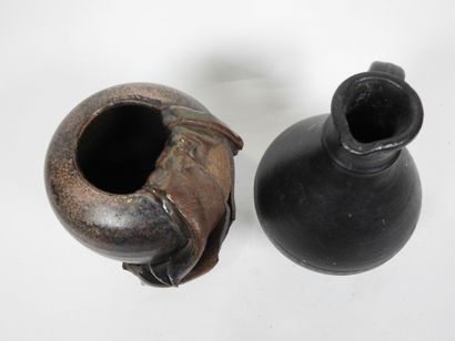 Set including :
- Black-glazed ceramic pitcher,...