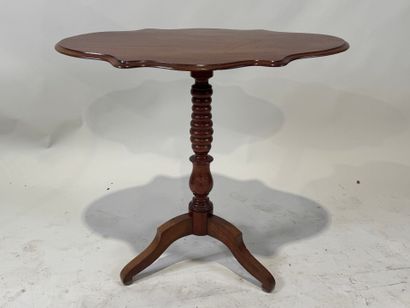 Wooden pedestal table with tilted top.
72...