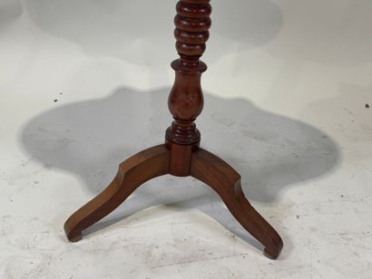 Wooden pedestal table with tilted top.
72...