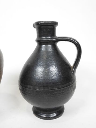 Set including :
- Black-glazed ceramic pitcher,...