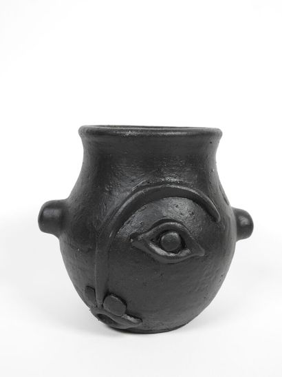 Set including :
- Black-glazed ceramic pitcher,...