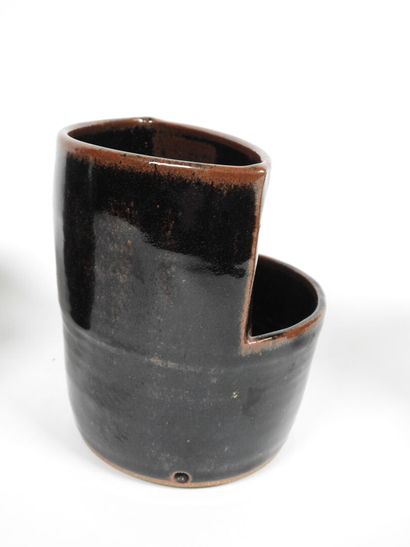 Set including :
- Black-glazed ceramic pitcher,...
