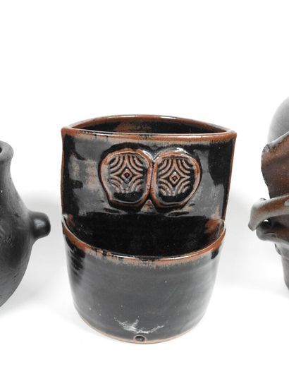 Set including :
- Black-glazed ceramic pitcher,...