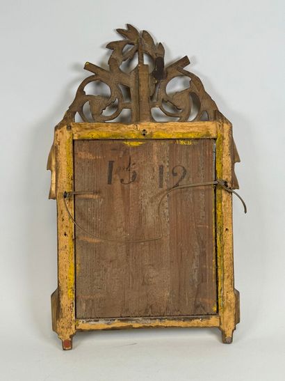 Small gilded and carved wood mirror decorated...