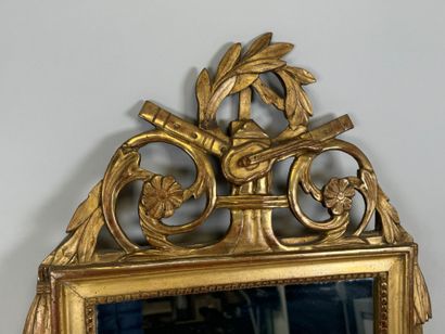Small gilded and carved wood mirror decorated...