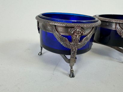 Suite of four salt cellars with solid silver...