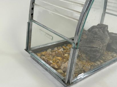 Small cage in chromed metal and glass.
34...