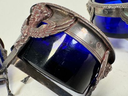 Suite of four salt cellars with solid silver...