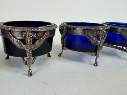 Suite of four salt cellars with solid silver...