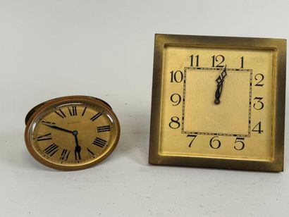 Two brass and glass alarm clocks, one 