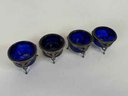 Suite of four salt cellars with solid silver...