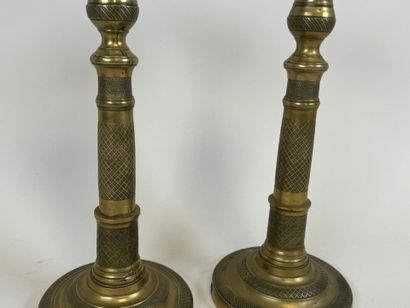 Pair of torches in chased bronze, the circular...