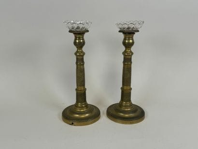 Pair of torches in chased bronze, the circular...