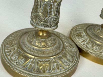 Lot including :
- A pair of ormolu and chased...