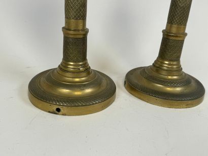 Pair of torches in chased bronze, the circular...