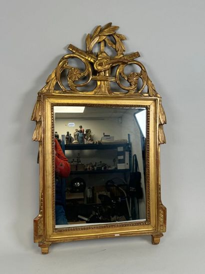Small gilded and carved wood mirror decorated...