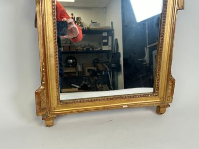Small gilded and carved wood mirror decorated...