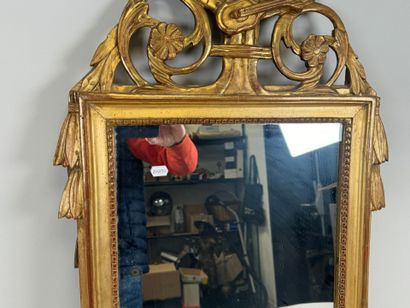 Small gilded and carved wood mirror decorated...
