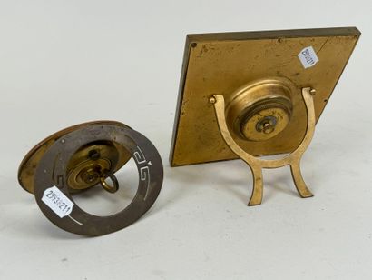 Two brass and glass alarm clocks, one 