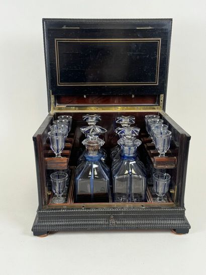 Liqueur cellar in blackened wood and brass...