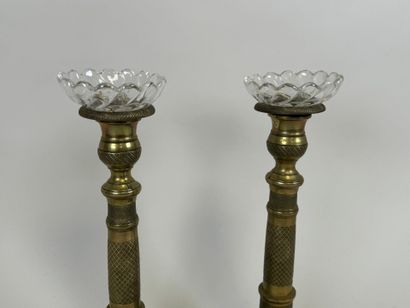 Pair of torches in chased bronze, the circular...